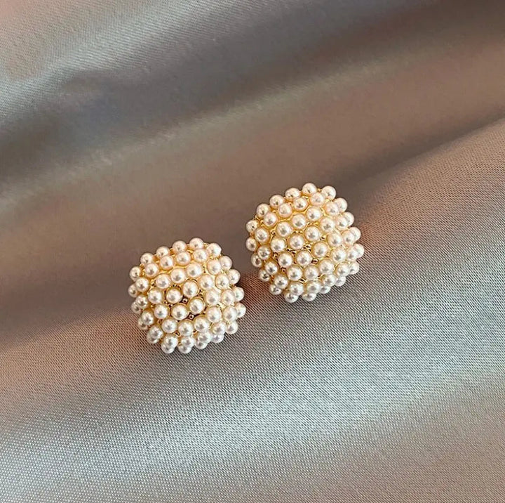 Elegantné Náušnice z Oka so Vloženými Perlovými